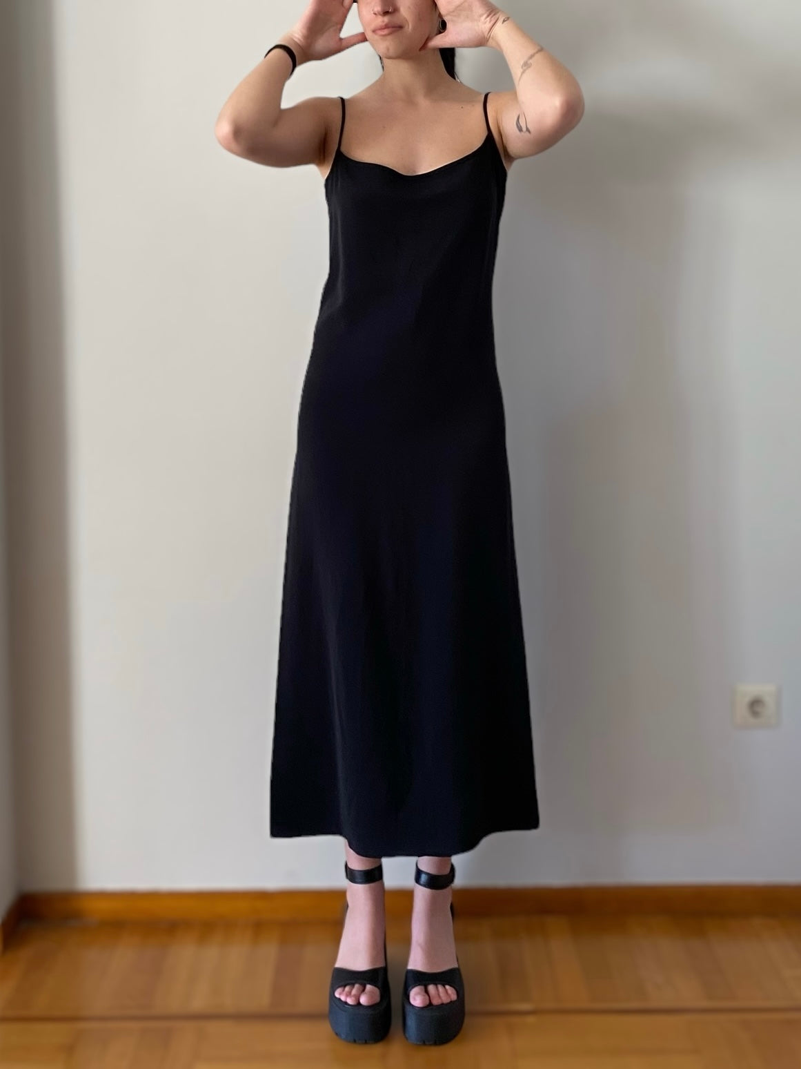 Vintage black dress with unique buttons on the back