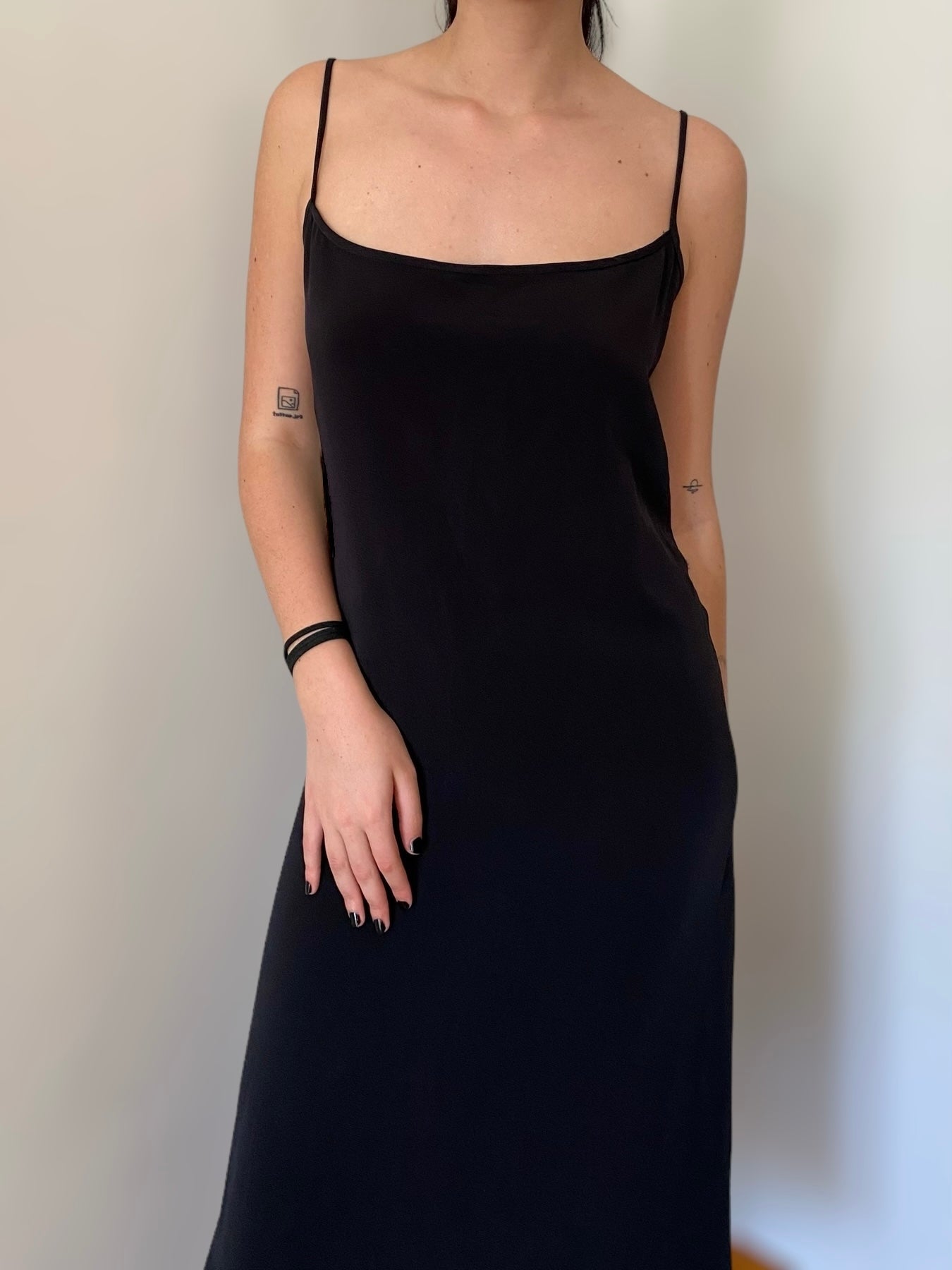 Vintage black dress with unique buttons on the back